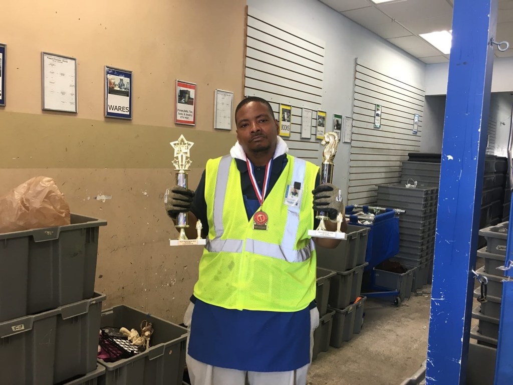 CEO wearing a yellow safety vest.