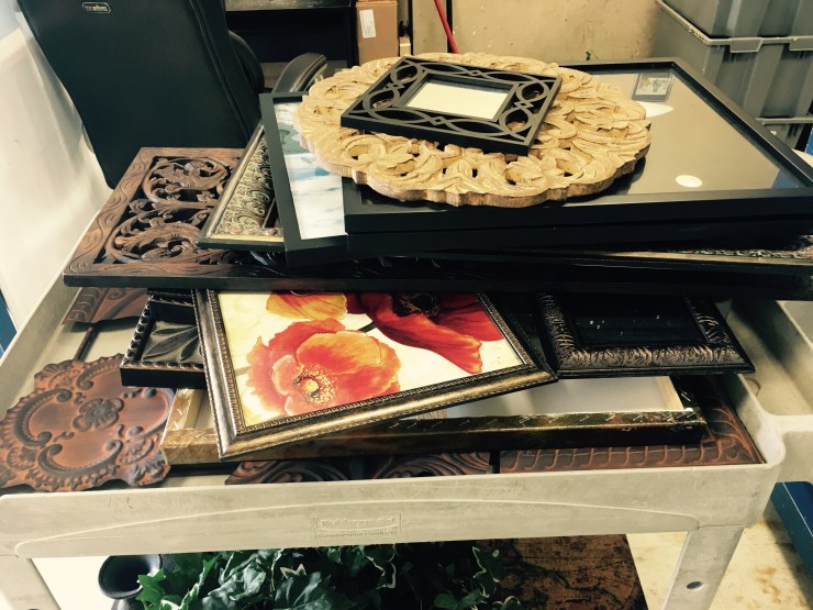 Picture frames on a cart.