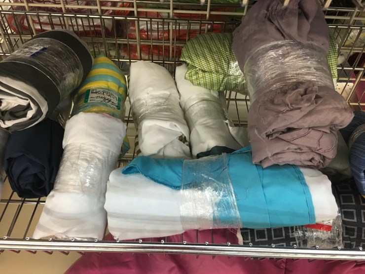 Sheets at a thrift store.