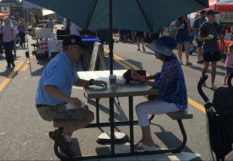Man and woman sitting across from each other.
