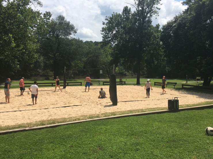People playing beach volleyball.
