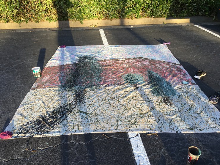 A painting in two parking spaces.