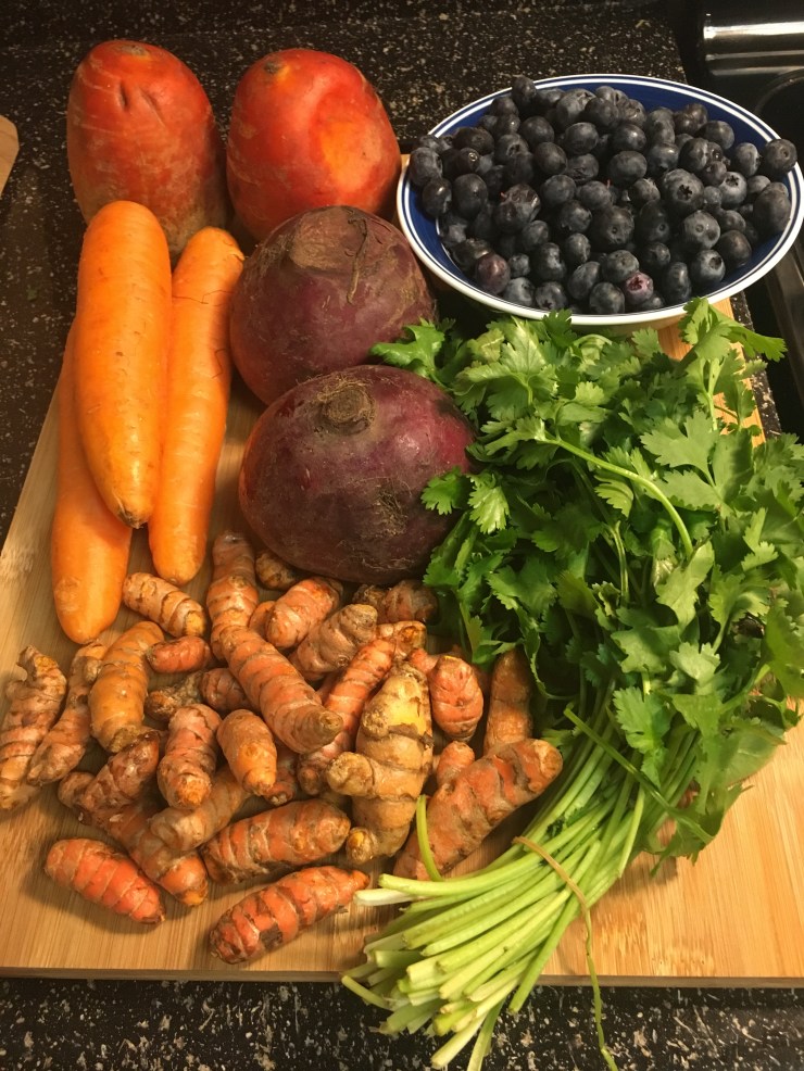 Beets, carrots, turmeric, blueberries and cilantro.