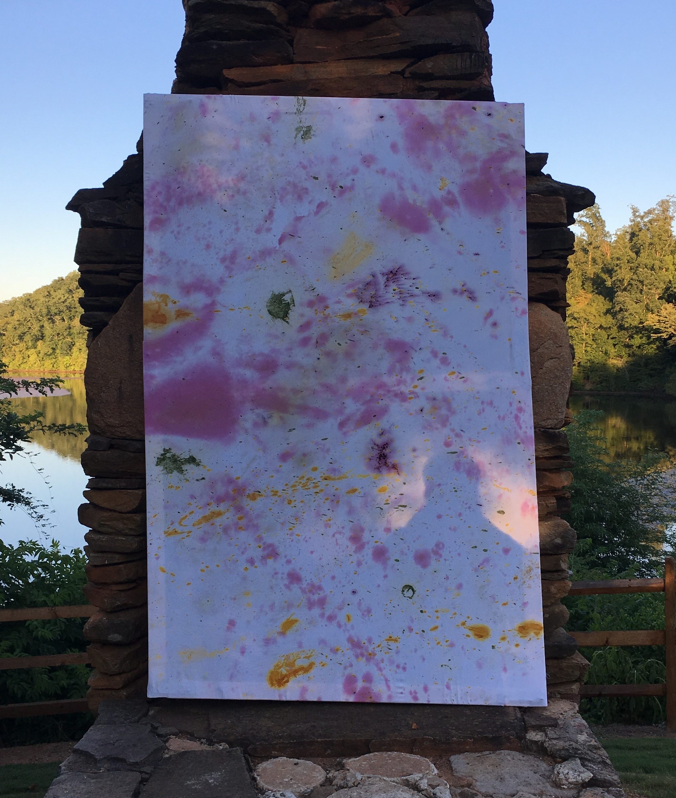 A painting in front of a chimney.