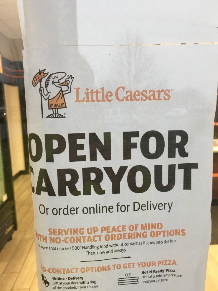 Little Caesar take out only sign.