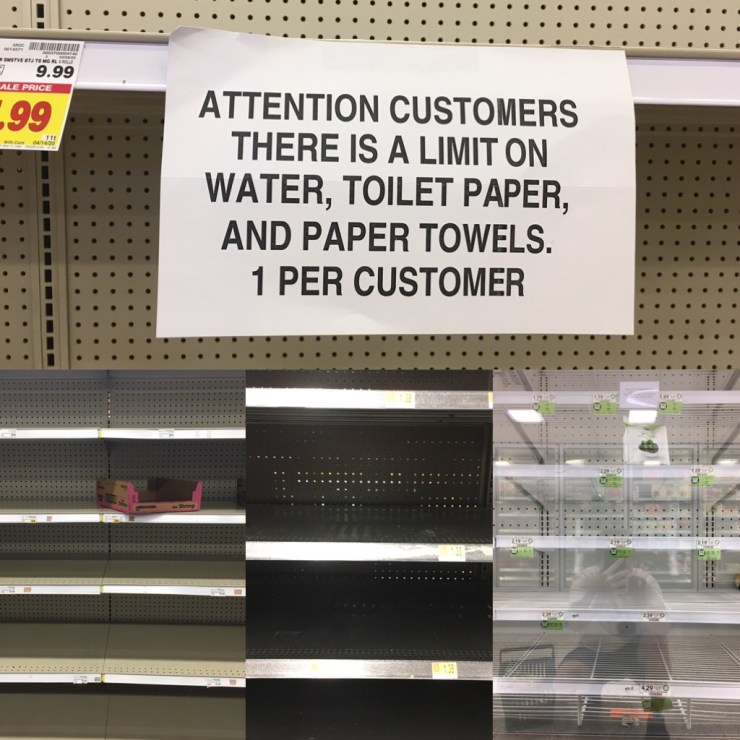Empty shelves and one per customer sign.