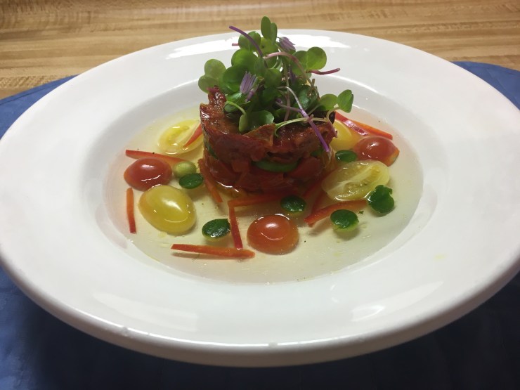 Gazpacho with tomato water, tomato confit and marinated peppers.