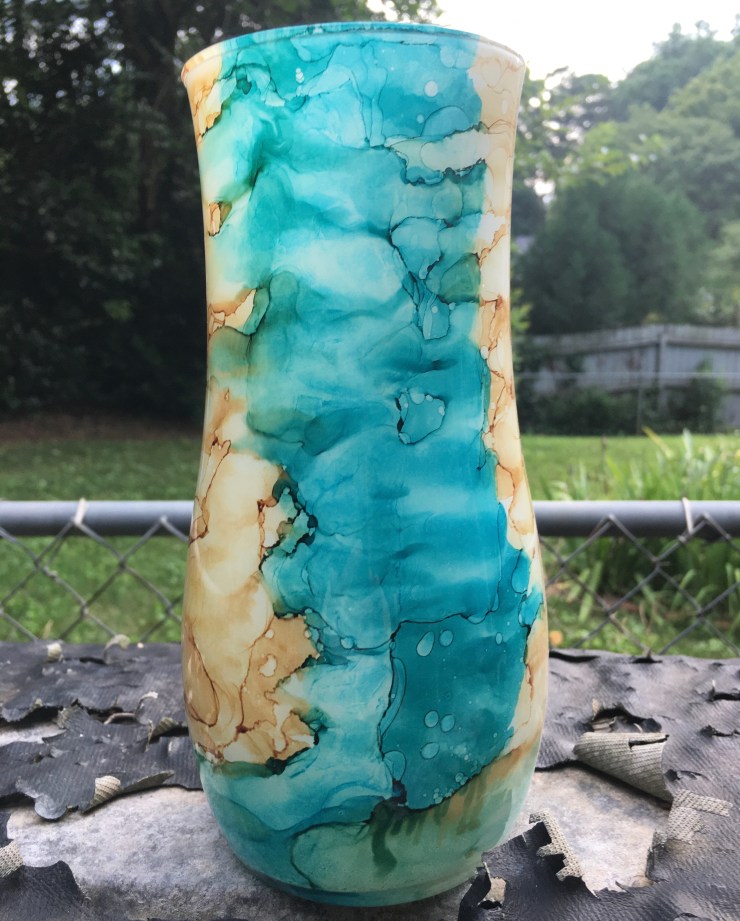 Turquoise glass vase.