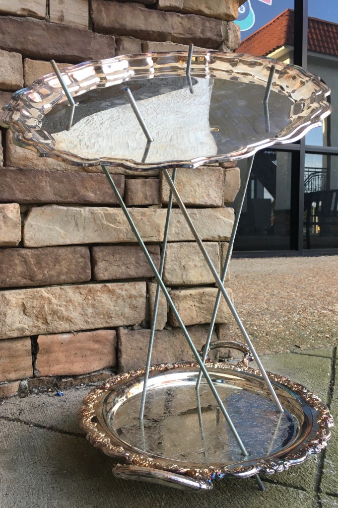 silver trays connected by metal rods.