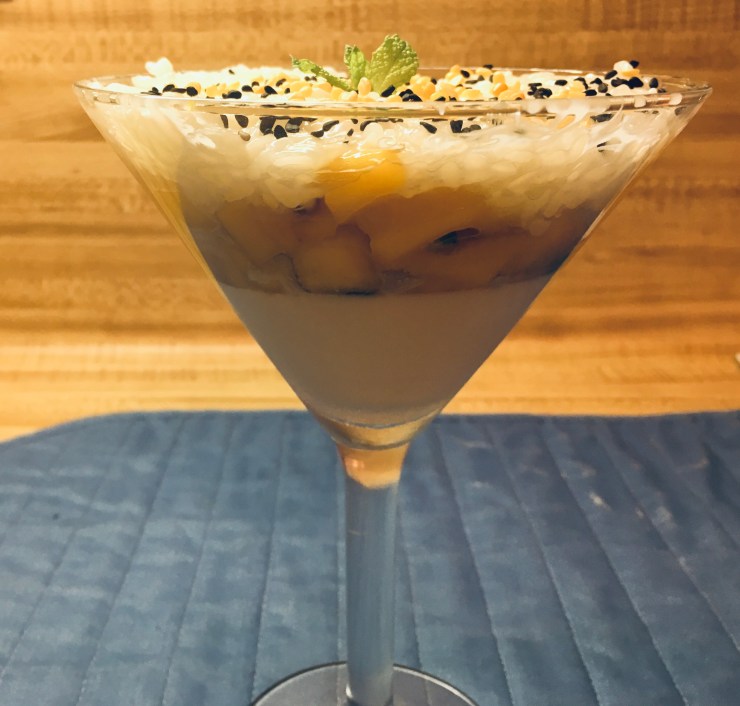 Side view of mango sticky rice parfait.
