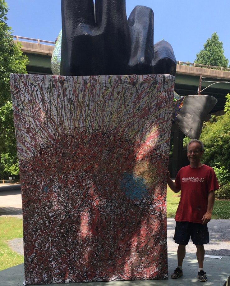 Me standing with painting next to “Ask the Fish”.