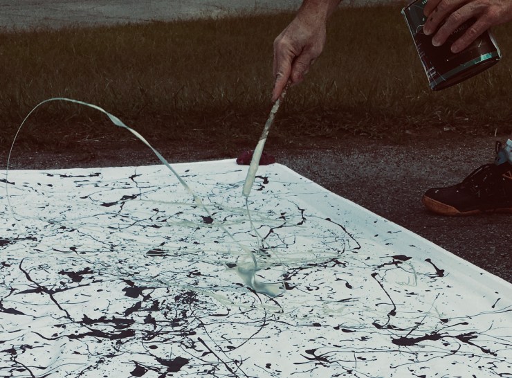 Paint flinging from a stick.