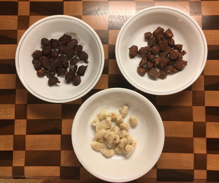 Dark, milk and white chocolate covered peanuts.