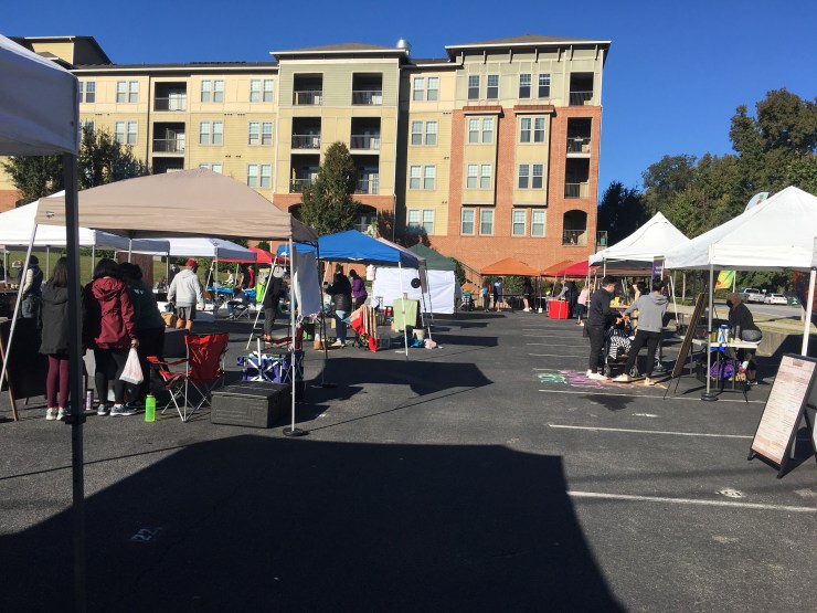 Foodies shopping at the farmer’s market.
