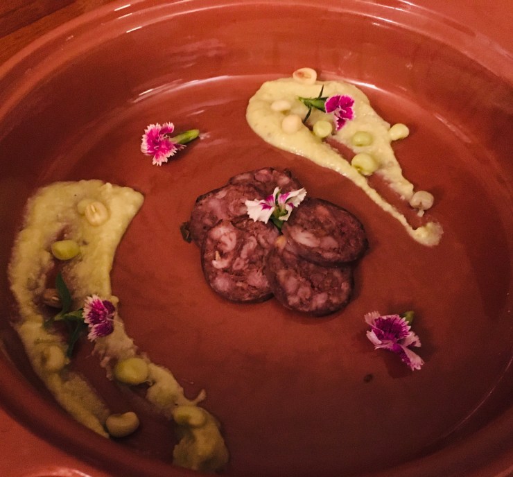 Blood sausage, zipper peas and pansies.