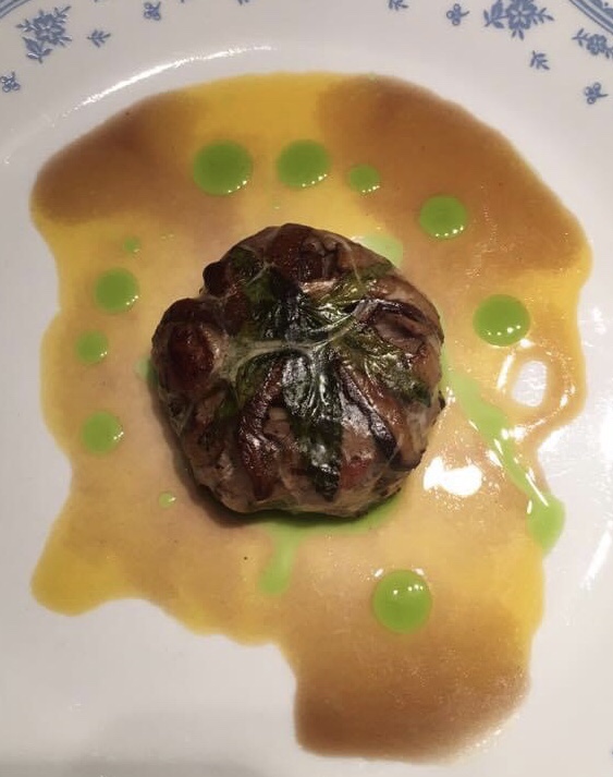 Duck crepinette with duck reduction, orange syrup and tarragon oil.