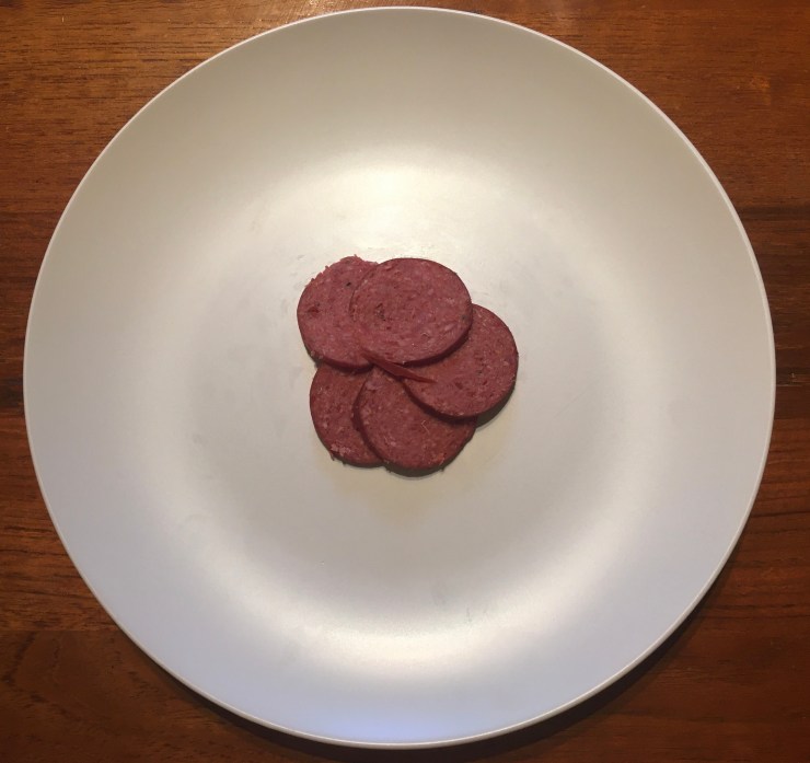 Salami on a plate without sauce.