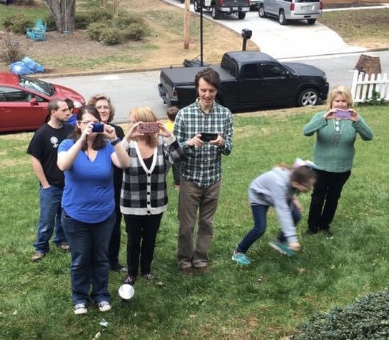 Hardins taking Christmas photos outside.