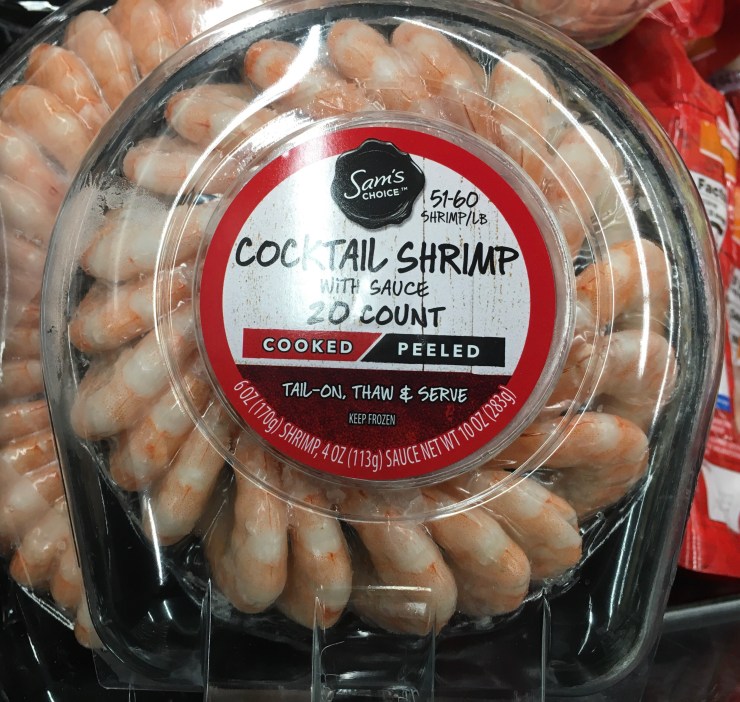 A container of frozen shrimp cocktail.