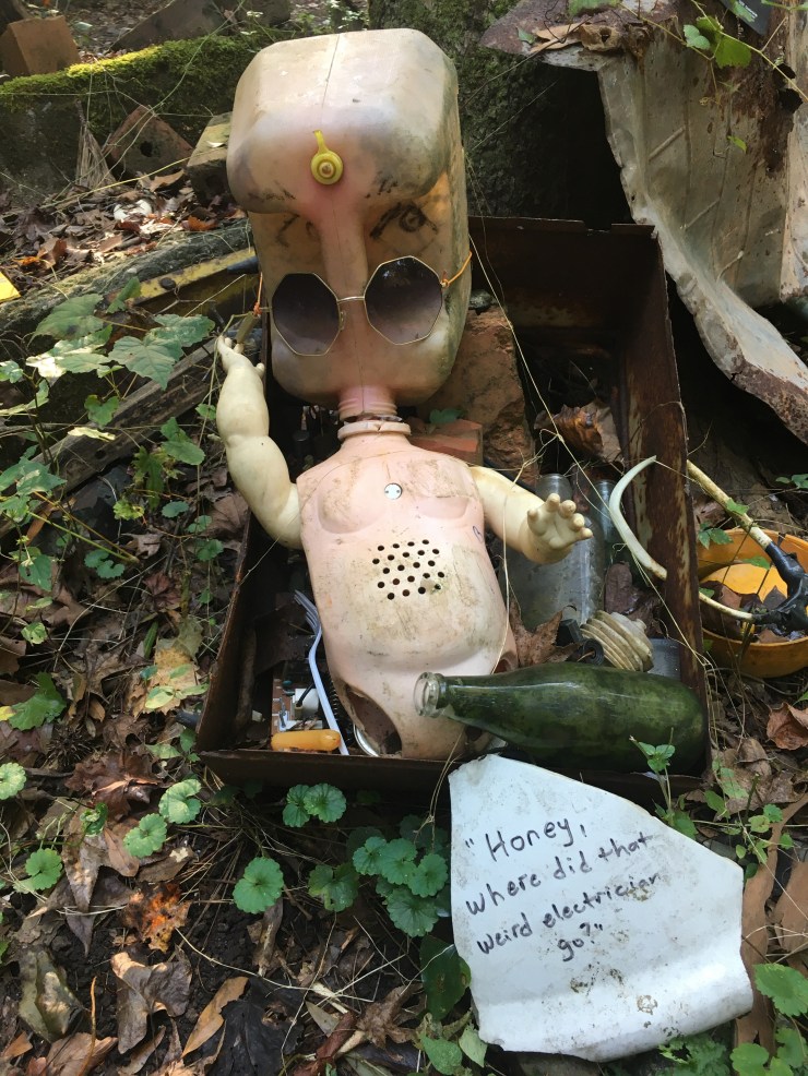 Doll’s body with water jug for head.