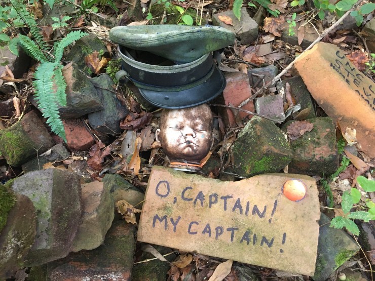 Doll’s head wearing ship’ captain cap.