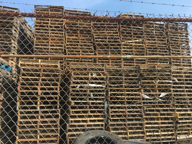 A wall of shipping pallets..