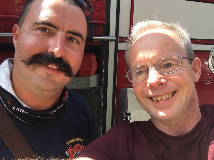 The author taking a selfie with a firefighter.