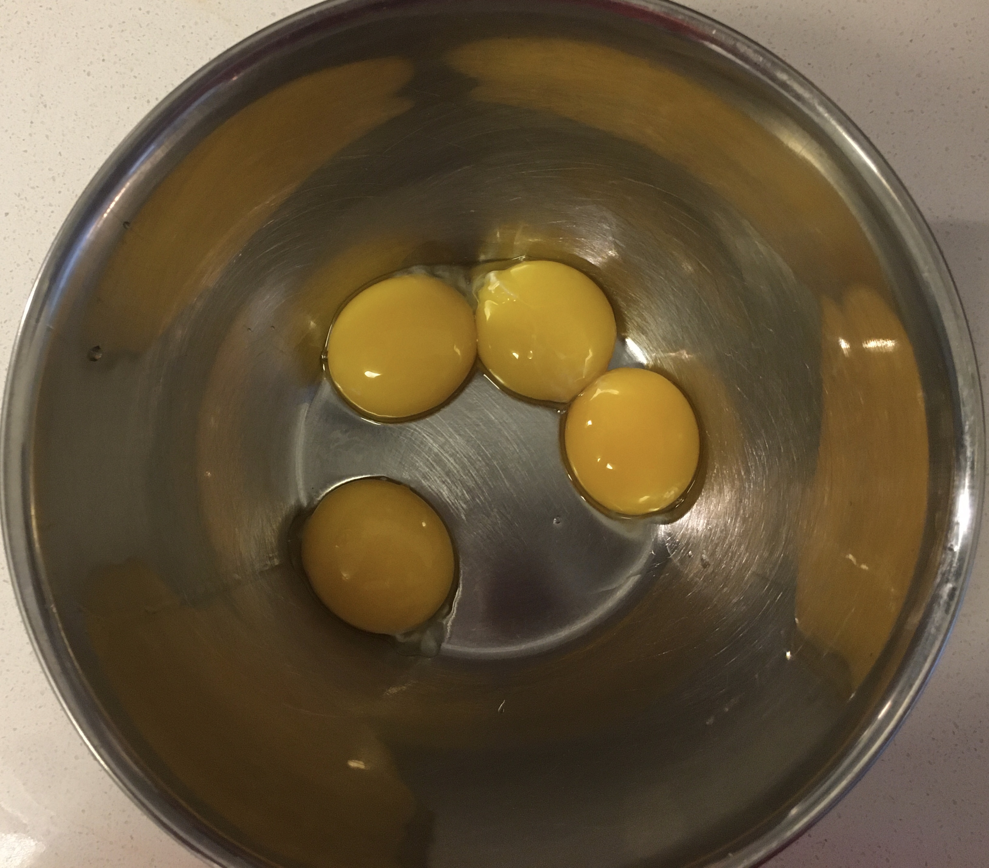 Whole Foods egg yolks in a bowl.