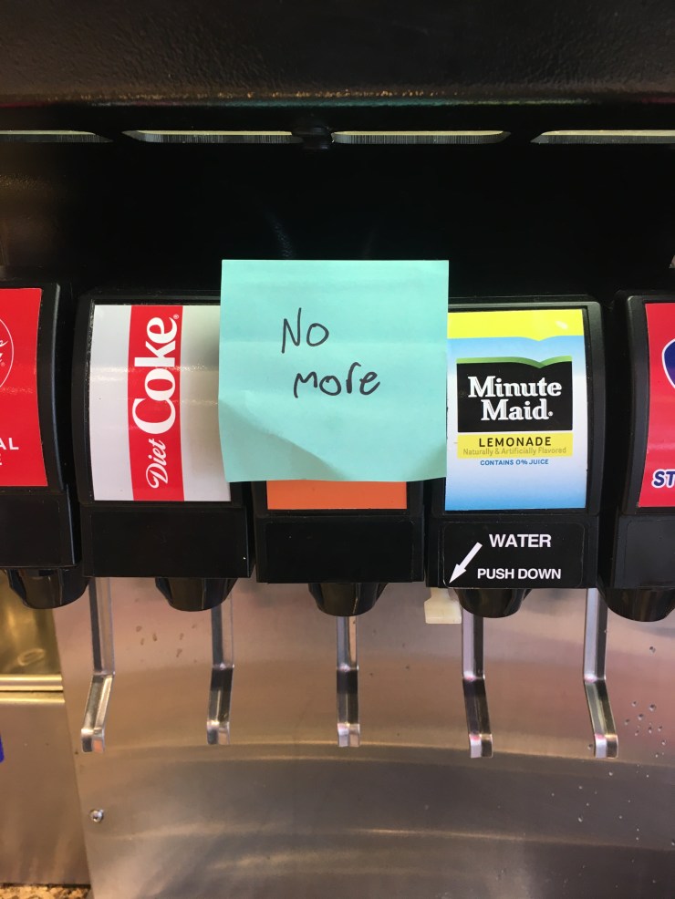 Post it note on a soda dispenser that reads “No more.”